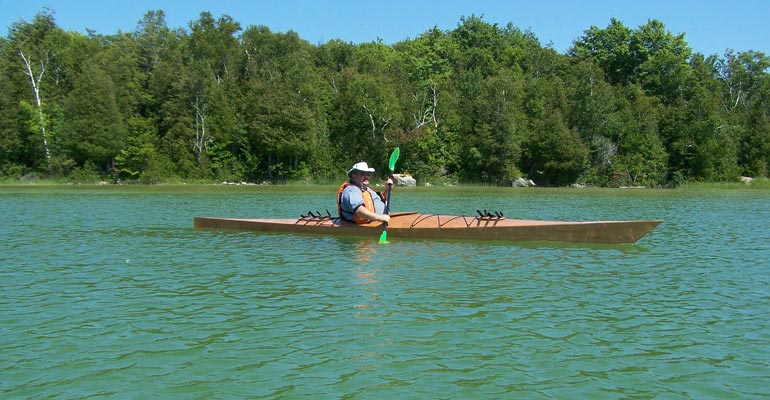 Stewart T. paddling his Chesapeake 18 wooden kayak