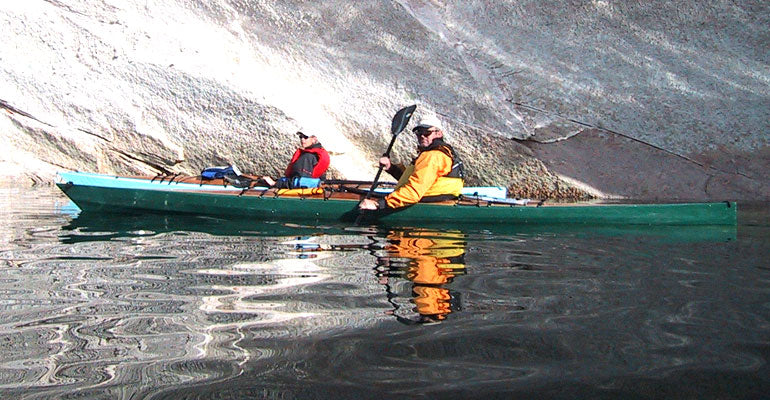 A green Chesapeake 18 wooden kayak built by Scott C. on Lake Powell