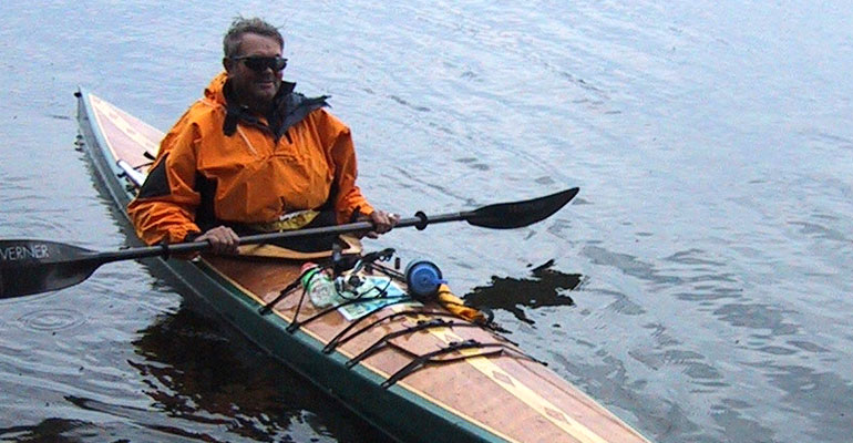 A Chesapeake 18 wooden kayak with decorative stripping on the deck, built by Scott C.