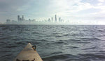 The Chicago skyline seen over the bow of a Chesapeake 18 wooden kayak built by Robert P. Thumbnail