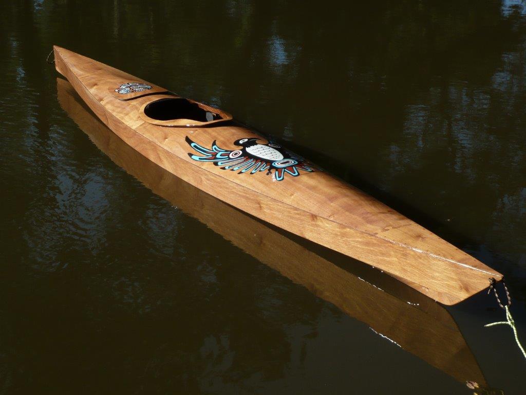 A Chesapeake 18 wooden kayak with custom decorated deck built by Tom P.