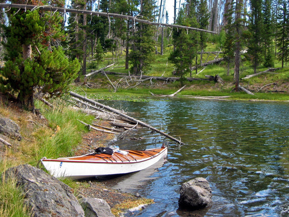 A Chesapeake 18 wooden kayak built by Bob W. on the bank of the Lewis River