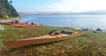 A Chesapeake 18 hybrid wooden kayak built by Mike J. loaded for camping on the lake shore Thumbnail