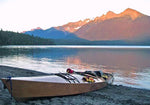 A pretty scene of a Chesapeake Double wooden kayak beached at a mountain lake Thumbnail