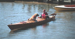 Paddling a Chesapeake Double wooden kayak with a dog along for the ride Thumbnail