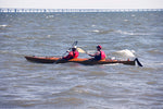 Two paddlers navigating rough water in a Chesapeake Double wooden kayak at OkoumeFest 2010 Thumbnail