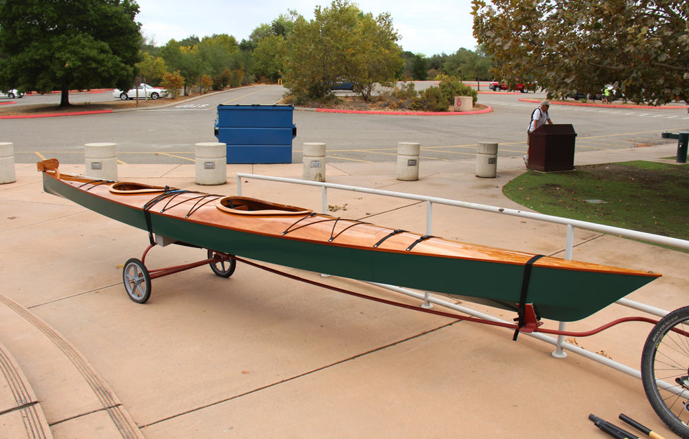 A Chesapeake Double wooden kayak built by Robert M. on a bicycle trailer in Sacramento, California
