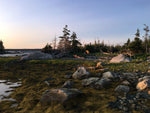 A Chesapeake Double wooden kayak built by Doug F. beached at a campsite at low tide in Nova Scotia. Thumbnail