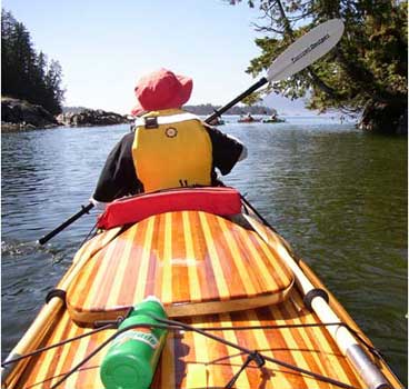 A view from the aft cockpit of a Chesapeake Triple wooden kayak built by Ed C.
