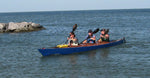 A trio of paddlers heading for shore in a Chesapeake Triple wooden kayak built by Jason R. Thumbnail