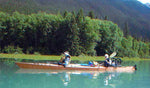 A couple paddling a loaded Chesapeake Triple wooden kayak built by Mike K. Thumbnail