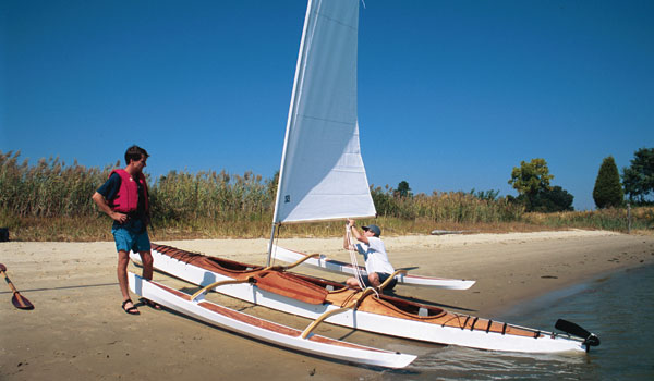 A Chesapeake Triple wooden kayak rigged up for sailing