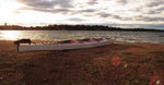 A beached Chesapeake Triple wooden kayak. Thumbnail