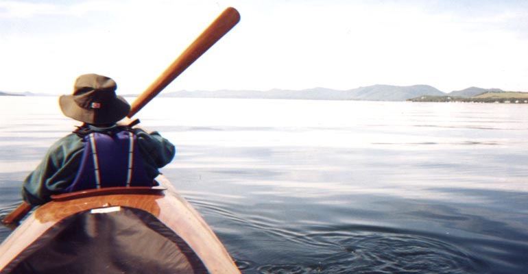 A view from the aft cockpit of a Chesapeake Triple wooden kayak built by Rene A.