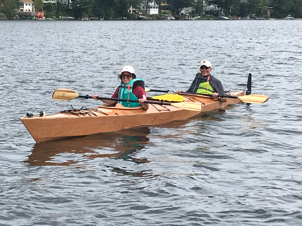 A couple paddling a Chesapeake Triple wooden kayak built by Robert B.