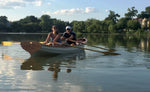 A couple enjoying a tandem row in UGKRIT, a Chester Yawl.
 Thumbnail