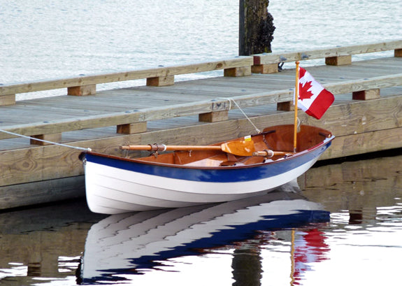 Glistening Chester Yawl built by Mike Jennings is tied up to a dock in Port Moody, British Columbia.