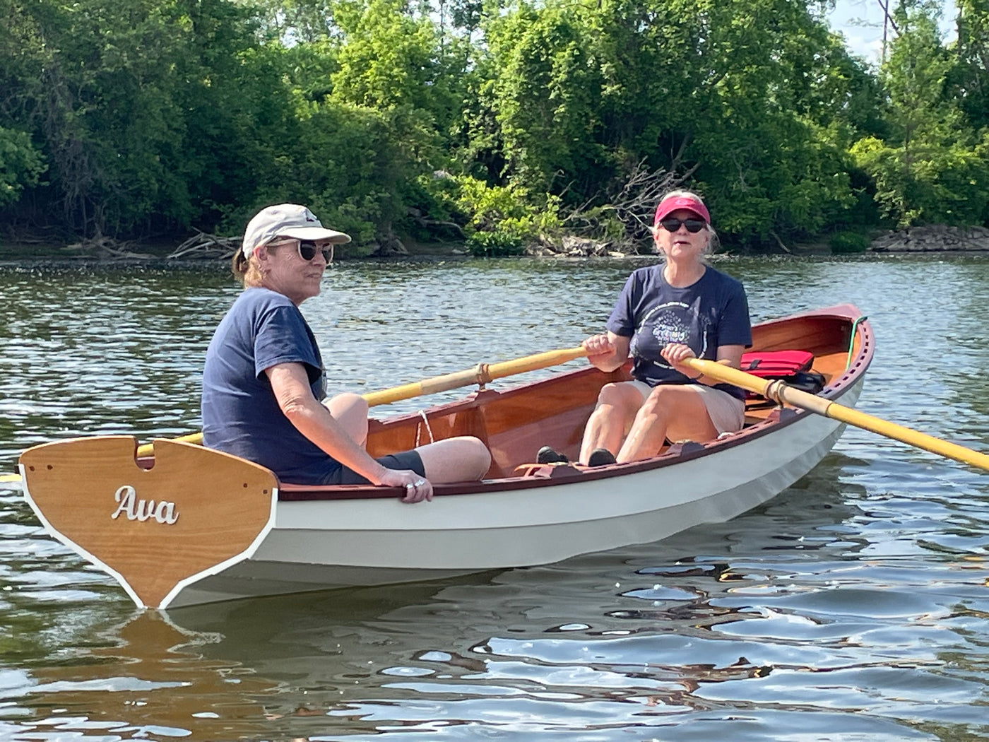 Woman rowing with a friend in her Chester Yawl, AVA.