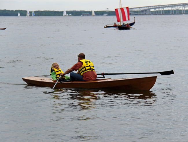 Father and daughter trying out an Expedition Wherry.