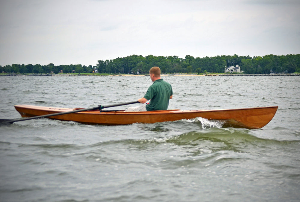 John H. rowing the Expedition Wherry in a choppy sea.