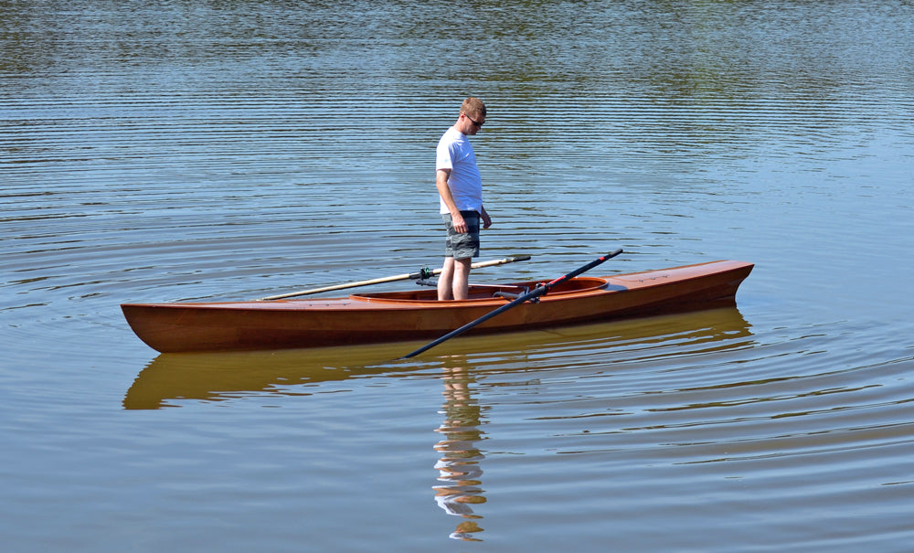 John Harris testing the stability of an Expedition Wherry.