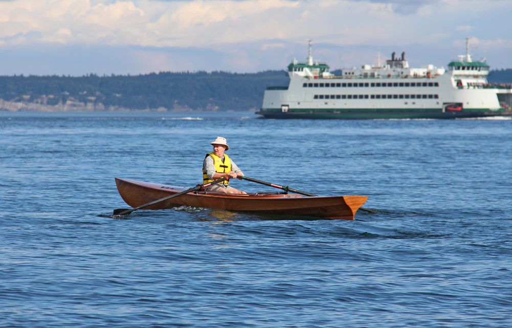 At the Port Townsend Wooden Boat Festival, an attendee tries out the Expedition Wherry.