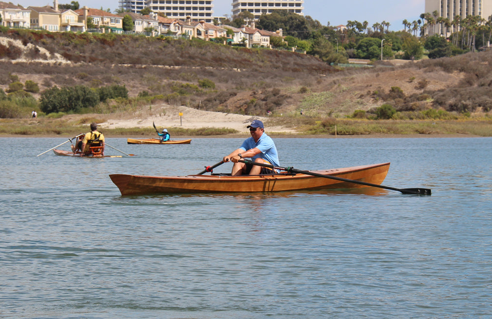 Joey paddling an Expedition Wherry in Newport Beach, California.