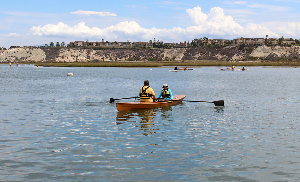 Several boats, including the Expedition Wherry, were afloat off the coast of Newport Beach, California.