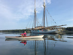 Christine Y. rows near the schooner MARY DAY in her Expedition Wherry. Thumbnail