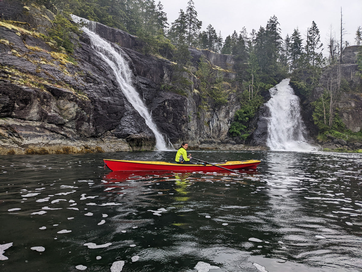 An Expedition Wherry waiting beneath the waterfalls at Teakeme Arm Provincial Park in British Columbia.