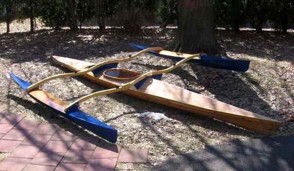 A Great Auk 17 sea kayak with a CLC Sail Rig conversion for use as a trimaran