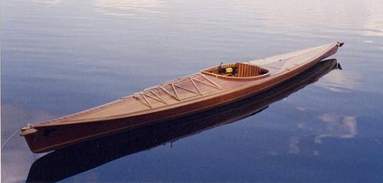 A Great Auk 17 sea kayak floating on glassy water by Alejandro S