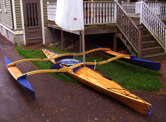 A Great Auk 17 strip-built sea kayak set up for sailing with a CLC Sail Rig