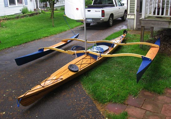 A Great Auk 17 sea kayak fitted with a CLC Sail Rig for trimaran sailing