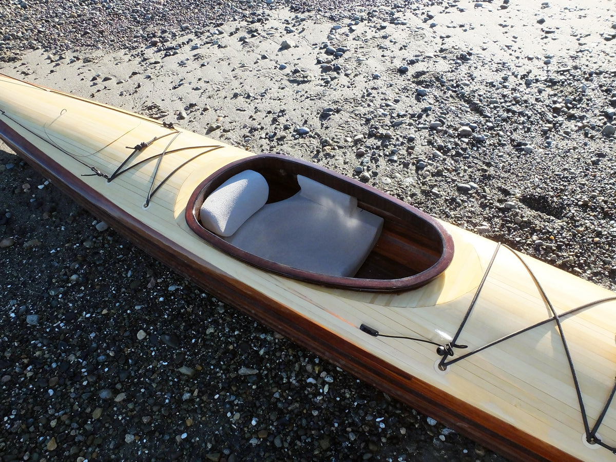The cockpit of an Expedition Single wooden kayak built by Casey W