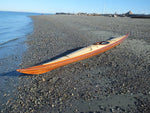 An Expedition Single wooden kayak on the beach Thumbnail