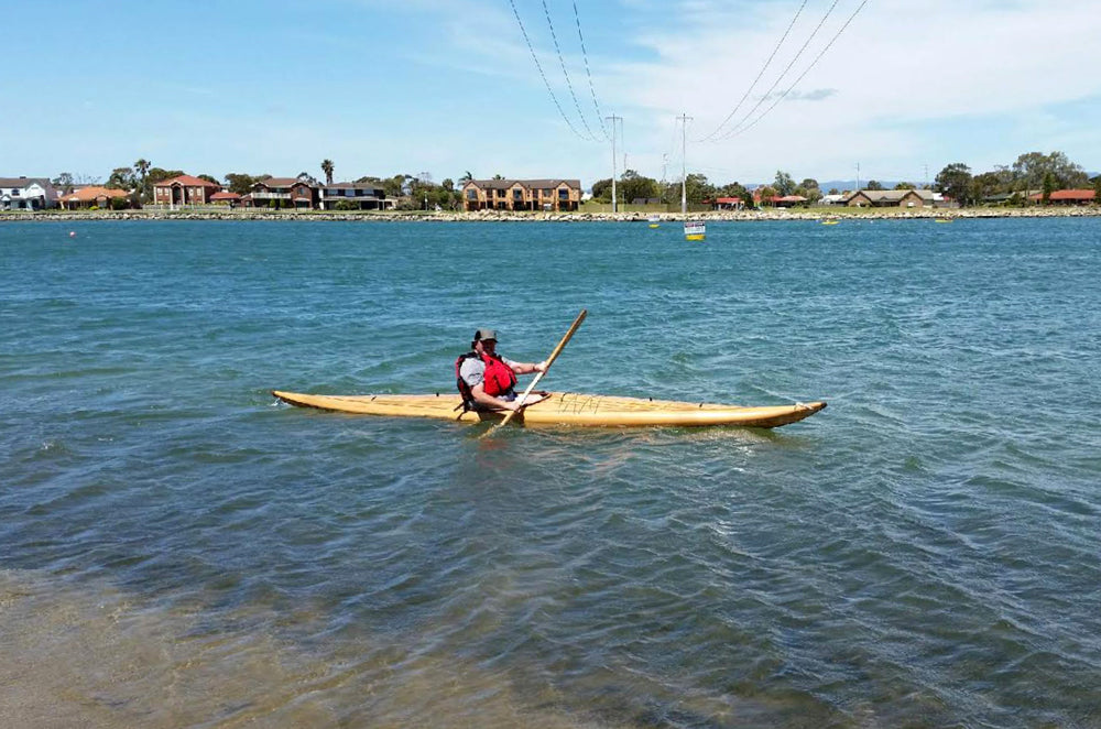 Paddling a Guillemot Single wooden kayak built by Chris in Australia