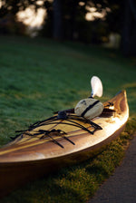 John W's Guillemot Single wooden kayak on the grass Thumbnail
