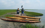 Guillemot and Auk wooden kayaks built by Tony O. at the water's edge Thumbnail
