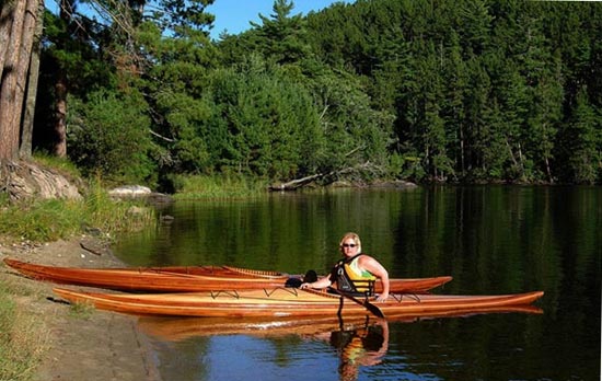 Troy G's Guillemot Single wooden kayak at the lake shore