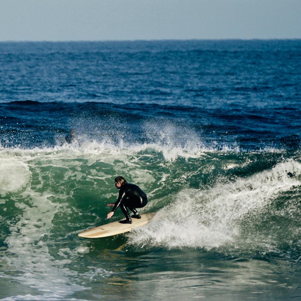 Grain Sapling Surfboard on the water