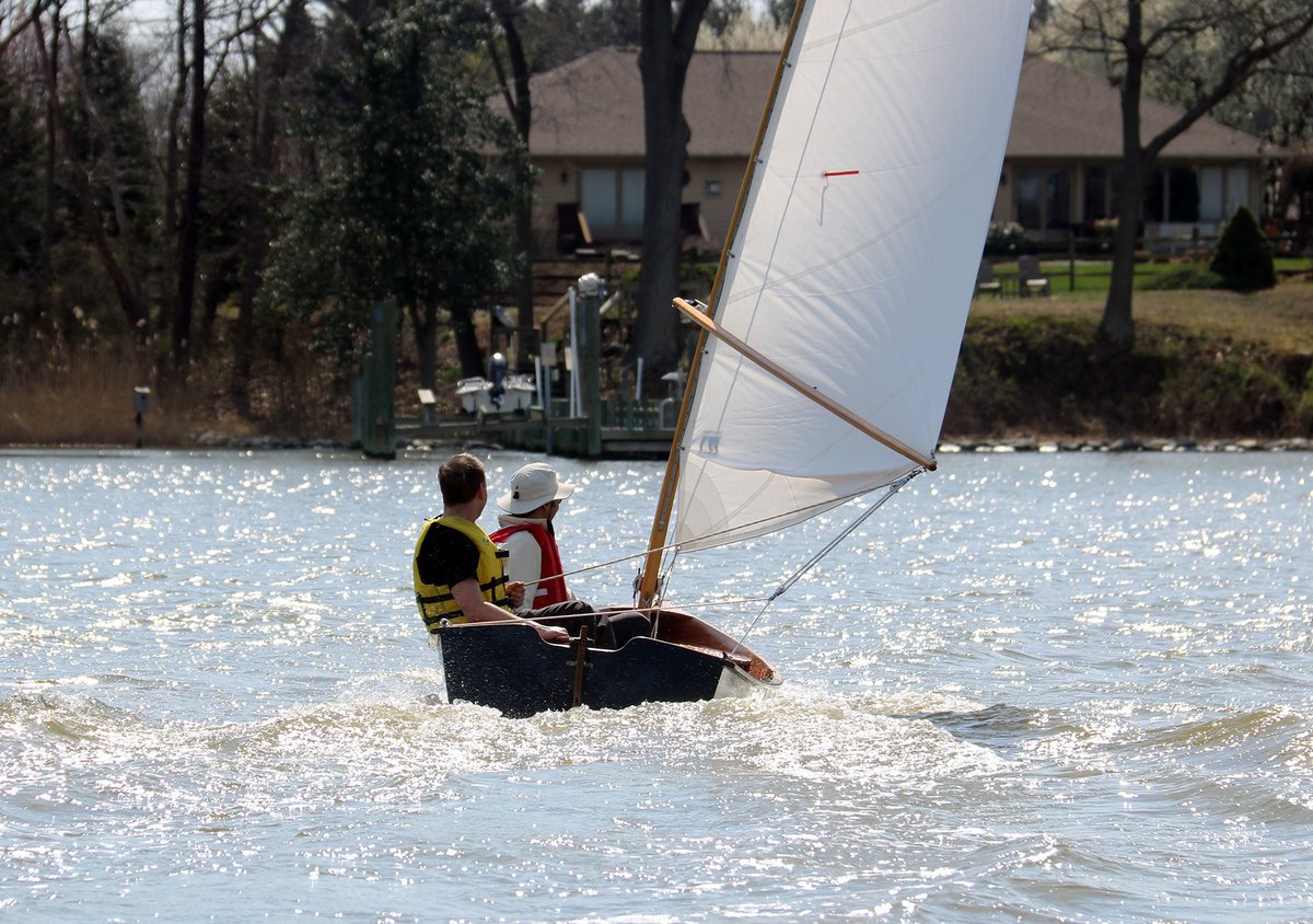 Two men sailing a CLC Jimmy Skiff.