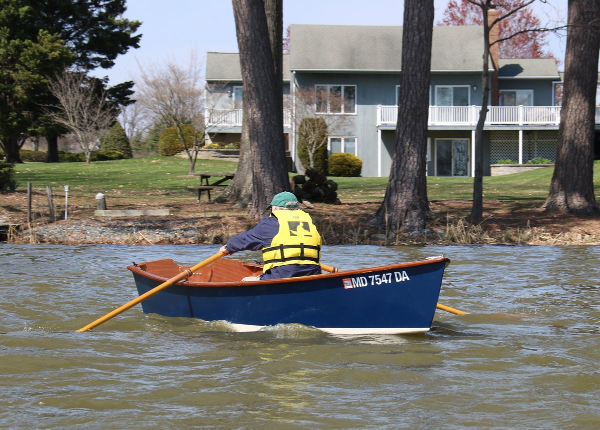 One man rowing a CLC Jimmy Skiff.