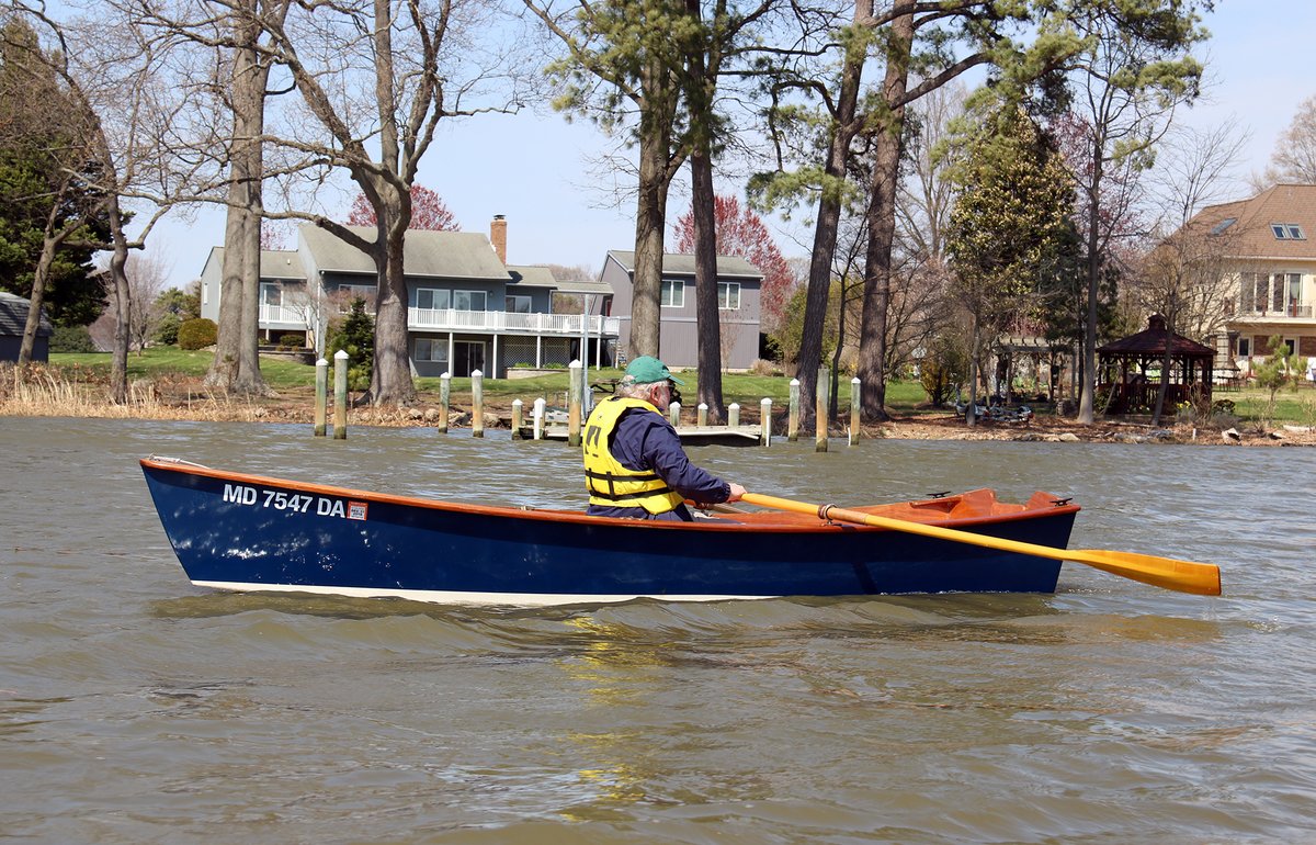 One man rowing a CLC Jimmy Skiff.
