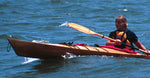 A woman paddling a Chesapeake 16LT wooden kayak Thumbnail