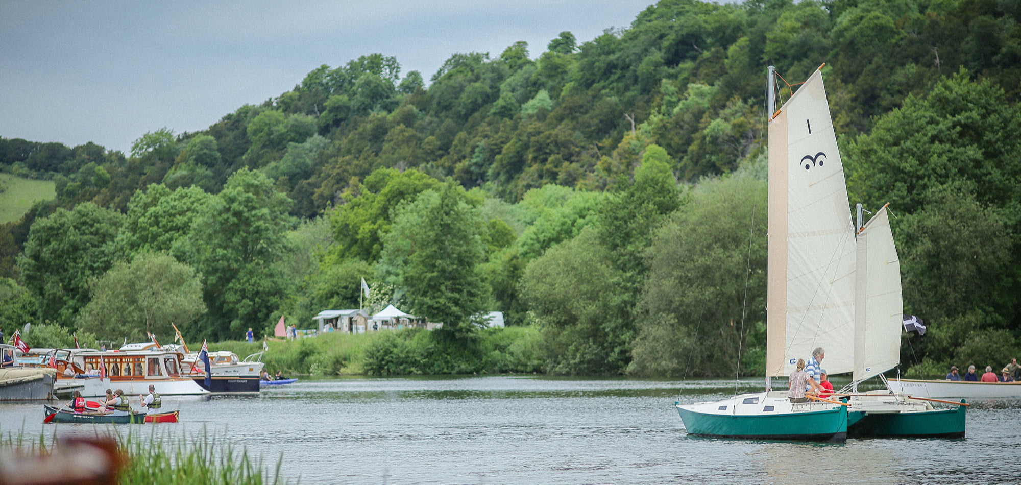 MANA is turning a few heads as she sails amongst the smaller craft.
