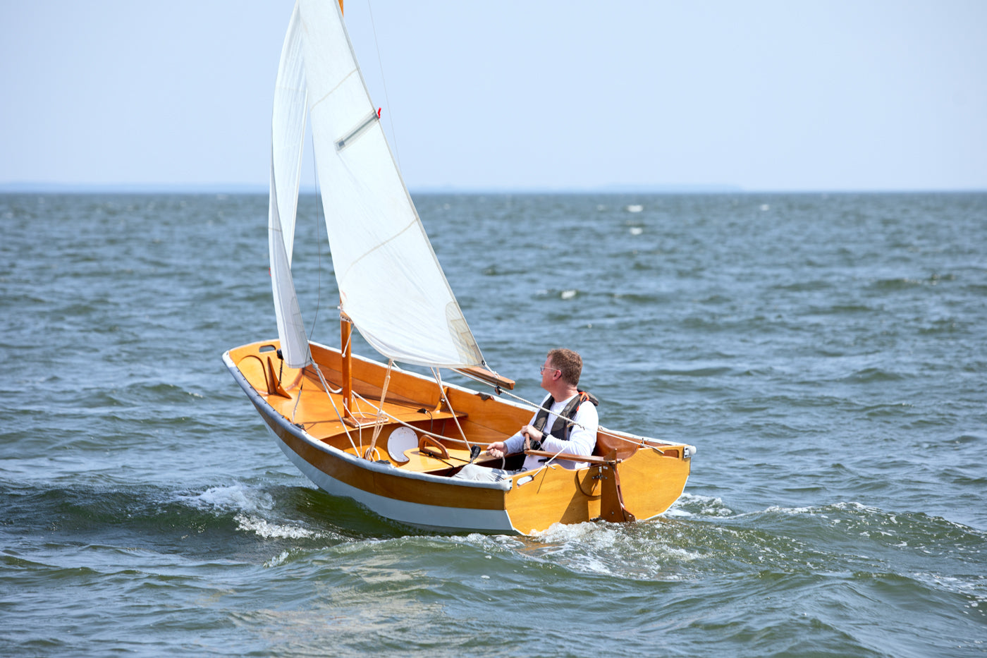 Passagemaker Dinghy with a Sloop Rig, sailing Crab Alley Bay, MD