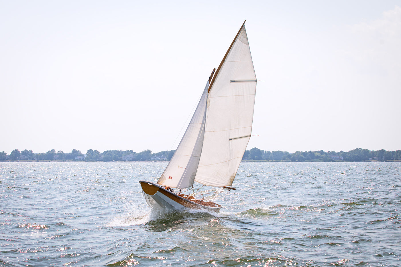 Passagemaker Dinghy with a Sloop Rig, sailing Crab Alley Bay, MD