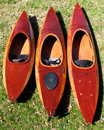 Wood Duck 10, 12, and 14 kayaks lined up on the lawn Thumbnail