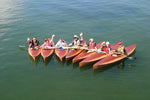 A flock of Wood Duck 10 kayaks launched at the WoodenBoat School Thumbnail